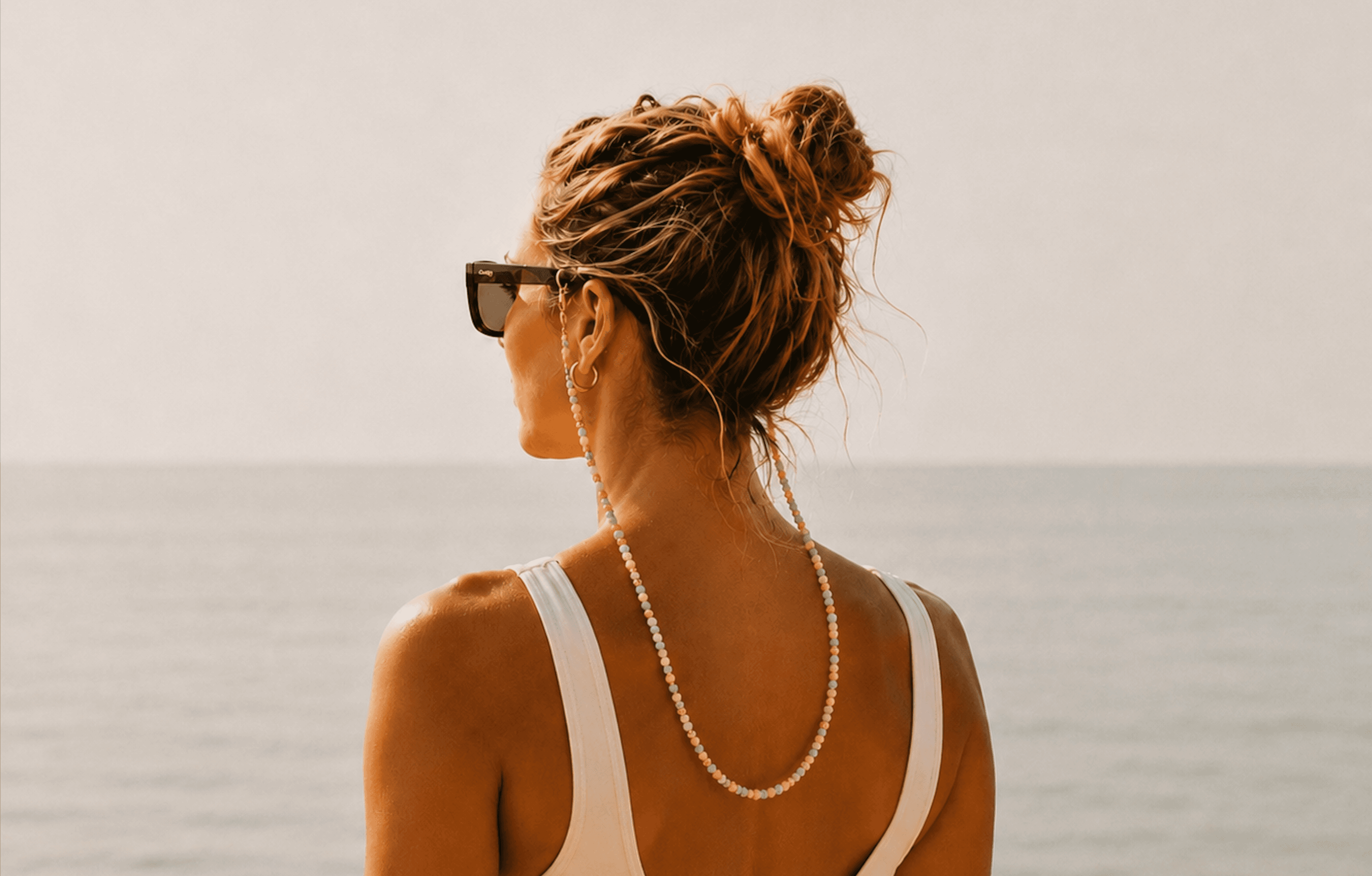 Model wearing UpYourSunnies strap in Byron Bay
